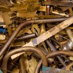 A pile of bronze scrap metal representing how our Indiana scrap metal recycling center can help you manage your scrap.